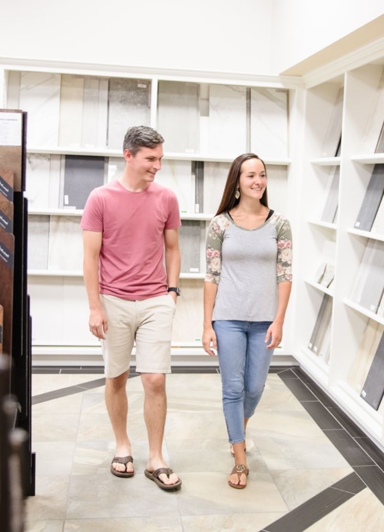 Two customers browsing tile and hardwood flooring