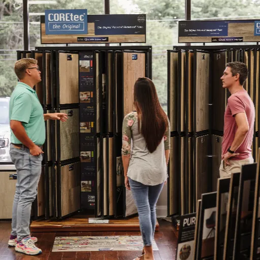 Couple Shopping for Flooring with Salesperson Helping 