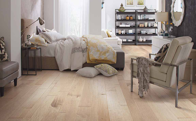 wide plank hardwood flooring in a bright modern bedroom